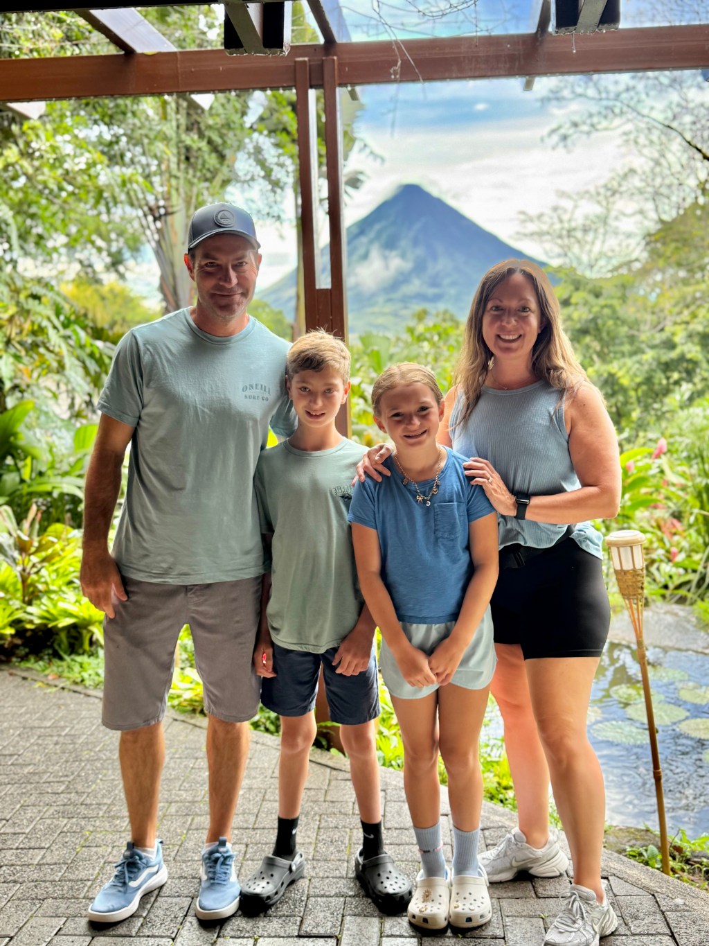 Family Standing in Front of Arenal Volcano
